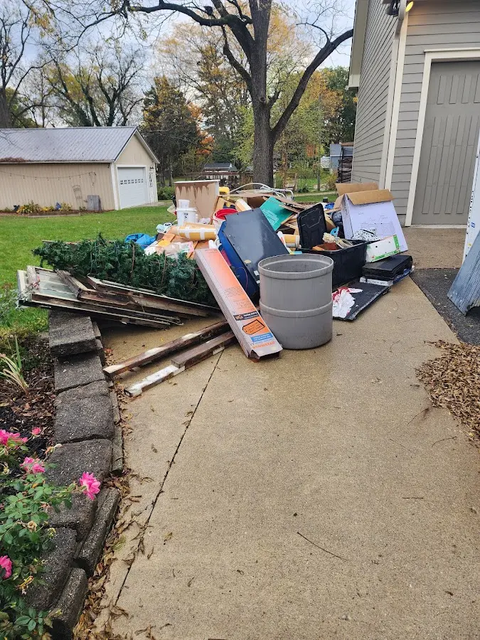 Dumpster being loaded with debris for Commercial Dumpster Rental in Norwalk